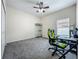 Empty bedroom showcasing neutral walls, carpeted flooring, ample natural light, and ceiling fan at 5852 Stafford Springs Trl, Orlando, FL 32829
