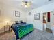 Bedroom with ceiling fan, carpet, and access to hallway, shows bright natural lighting at 5852 Stafford Springs Trl, Orlando, FL 32829