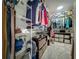Walk-in closet provides ample storage space with shelving, hanging racks, and organizers at 5852 Stafford Springs Trl, Orlando, FL 32829