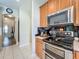 Gourmet kitchen featuring stainless steel appliances and plenty of cabinet space at 5852 Stafford Springs Trl, Orlando, FL 32829