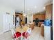 Spacious kitchen with wood cabinets, stainless steel appliances, center island, and a cozy breakfast nook at 5852 Stafford Springs Trl, Orlando, FL 32829