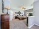 Neutral bedroom with a decorative wall, plush carpeting, and ample natural light at 5852 Stafford Springs Trl, Orlando, FL 32829
