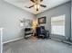 Comfortable office area with neutral walls, plush carpeting, and a well-lit work space at 5852 Stafford Springs Trl, Orlando, FL 32829