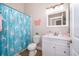 bathroom with vanity, butterfly decor, unicorn curtain, and a shower/tub combination at 603 Cypress Tree Ct, Orlando, FL 32825