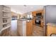 Bright kitchen featuring an island, modern appliances, and tile flooring at 603 Cypress Tree Ct, Orlando, FL 32825