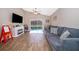 Spacious living room with a view of the screened pool area at 603 Cypress Tree Ct, Orlando, FL 32825