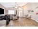 Inviting living area features tile flooring, bright lighting, and cozy seating at 603 Cypress Tree Ct, Orlando, FL 32825