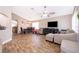 Open-concept living and dining area with tile flooring and natural lighting at 603 Cypress Tree Ct, Orlando, FL 32825