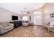 Bright living room with tiled floors, a front door view, and ample seating at 603 Cypress Tree Ct, Orlando, FL 32825