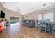 Living and dining areas with tile flooring, fireplace, and lots of natural light at 603 Cypress Tree Ct, Orlando, FL 32825