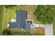 Aerial view of the home showcasing the roof, backyard, and surrounding landscape with mature trees at 609 Brockway Ave, Orlando, FL 32807