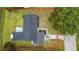 Aerial view of the home showcasing the roof, backyard, and surrounding landscape with mature trees at 609 Brockway Ave, Orlando, FL 32807