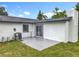 View of the home's backyard showing a large grassy area and patio at 609 Brockway Ave, Orlando, FL 32807
