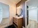 Stylish bathroom with a modern vanity, mirror, and hardware at 609 Brockway Ave, Orlando, FL 32807