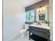 Nicely renovated bathroom with modern vanity and fixtures at 609 Brockway Ave, Orlando, FL 32807