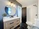 Stylish bathroom with modern vanity, fixtures, and tiling at 609 Brockway Ave, Orlando, FL 32807