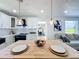 Kitchen features stainless steel appliances, white cabinets, wood countertops and an eat-in island at 609 Brockway Ave, Orlando, FL 32807