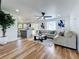Bright, open-concept living area with natural light, connecting living space to the kitchen island at 609 Brockway Ave, Orlando, FL 32807