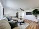 Inviting living area featuring contemporary decor, a comfortable sofa, and ample natural light at 609 Brockway Ave, Orlando, FL 32807