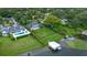 Aerial view of the home, showcasing the large lot, boat dock, and lush landscaping at 641 Virginia Dr, Winter Park, FL 32789