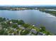 Lakefront houses with lush landscaping and a waterfront view at 641 Virginia Dr, Winter Park, FL 32789
