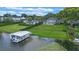 Gorgeous waterfront estate with lush lawn, private dock, and mature landscaping at 641 Virginia Dr, Winter Park, FL 32789