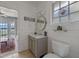 Charming half bathroom with shiplap walls, a stained-glass window, and modern fixtures at 641 Virginia Dr, Winter Park, FL 32789