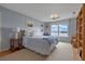 Bedroom with blue walls, water views, and built in shelves providing ample storage at 641 Virginia Dr, Winter Park, FL 32789
