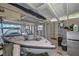 Inside the boathouse featuring a boat on a lift, mini fridge, and ample storage space at 641 Virginia Dr, Winter Park, FL 32789