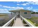 Exterior of the boathouse with a covered porch, wooden deck, and scenic lake view at 641 Virginia Dr, Winter Park, FL 32789