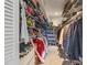 Spacious walk-in closet featuring ample shelving, hanging racks, and organized storage space at 641 Virginia Dr, Winter Park, FL 32789