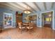 Open dining room with hardwood floors, a wooden table set, and access to living areas at 641 Virginia Dr, Winter Park, FL 32789