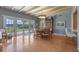 Bright dining room with sliding glass doors, tile flooring, and a classic dining set at 641 Virginia Dr, Winter Park, FL 32789