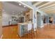 Bright kitchen with white cabinetry, stainless steel appliances, and breakfast bar at 641 Virginia Dr, Winter Park, FL 32789