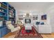 Cozy living room with a fireplace, built-in bookshelves, and comfortable seating at 641 Virginia Dr, Winter Park, FL 32789