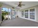 Enclosed porch with sliding doors and windows leading to outdoor patio at 641 Virginia Dr, Winter Park, FL 32789