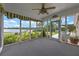 Enclosed porch with sliding windows offering scenic lake views and outdoor access at 641 Virginia Dr, Winter Park, FL 32789