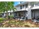 Backyard view of the property featuring a screened lanai and views of the lawn at 6931 Sperone St, Orlando, FL 32819