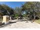 Front view of the community entrance with decorative columns at 6931 Sperone St, Orlando, FL 32819