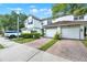 Charming home exterior featuring an attached two car garage and well maintained landscaping at 6931 Sperone St, Orlando, FL 32819