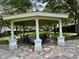 Community gazebo with ample seating and a tiled floor, perfect for relaxing or entertaining at 6931 Sperone St, Orlando, FL 32819