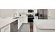Modern kitchen with stainless steel appliances, a breakfast bar, and sleek countertops at 6931 Sperone St, Orlando, FL 32819