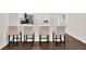 Stylish kitchen with bar stool seating, an island, and hardwood floors at 6931 Sperone St, Orlando, FL 32819