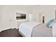 This main bedroom features dark wood floors, neutral gray and white palette, and modern fixtures at 6931 Sperone St, Orlando, FL 32819