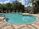 Community pool with clear blue water and spacious patio area at 6931 Sperone St, Orlando, FL 32819
