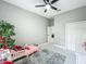 Cozy bedroom with a ceiling fan and gray decor at 704 Forest View Ct, Winter Springs, FL 32708