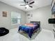 Cozy bedroom featuring a comfortable bed, ample natural light, and themed decor for a young baseball fan at 704 Forest View Ct, Winter Springs, FL 32708