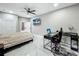 Bright bedroom featuring a ceiling fan, desk, and a closet at 704 Forest View Ct, Winter Springs, FL 32708
