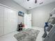 Functional bedroom features a bunk bed, TV, closet space, and neutral colors perfect for a  at 704 Forest View Ct, Winter Springs, FL 32708