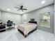 Spacious bedroom featuring a ceiling fan and bright, natural light at 704 Forest View Ct, Winter Springs, FL 32708